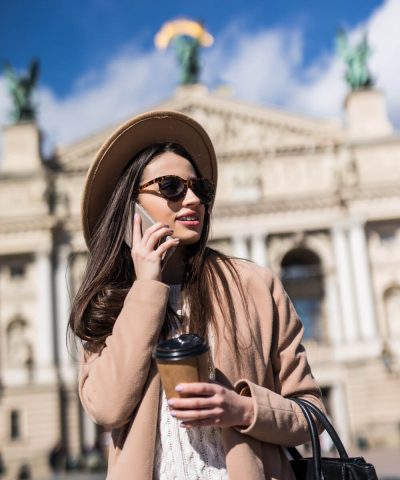 pretty-woman-with-braces-sunglasses-posing-casual-clothes-city (1)